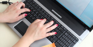 Woman Typing On Computer A (Preview Image)